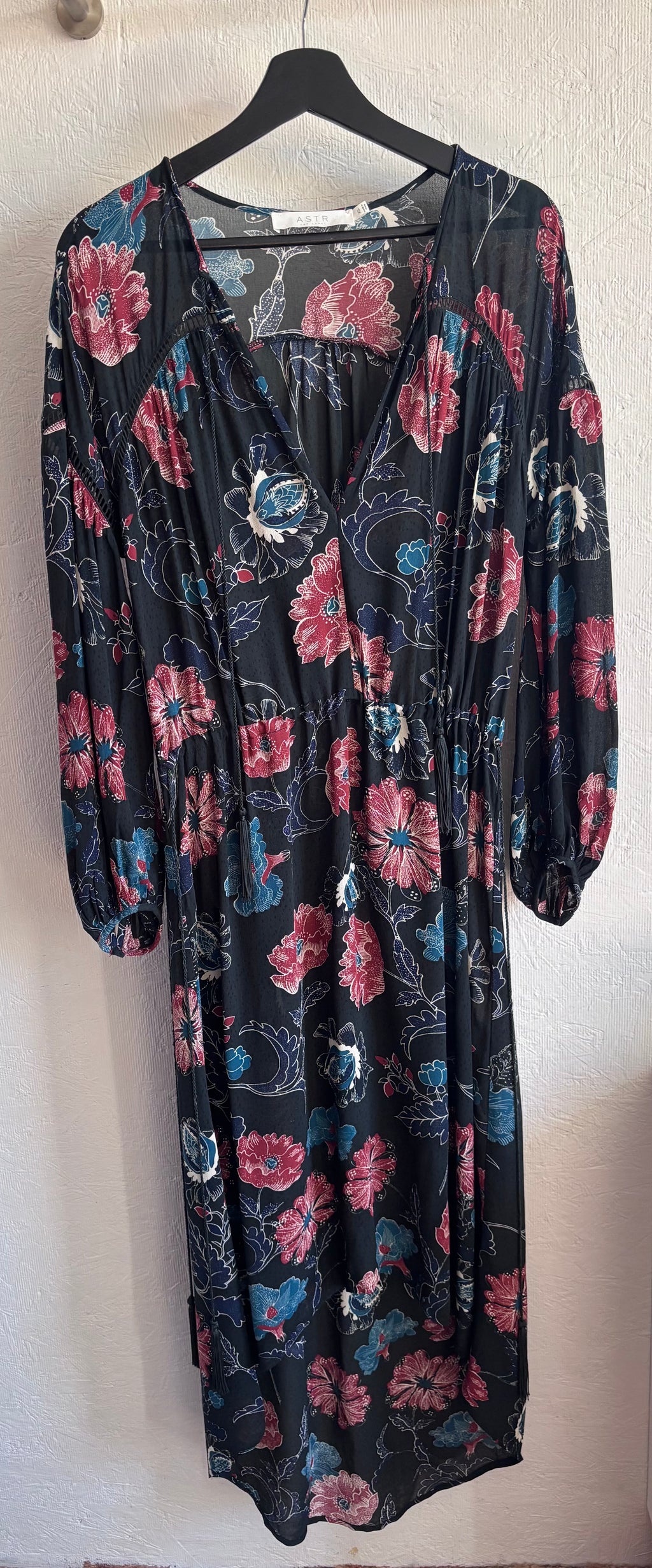 Revolve’s ASTR The Label Oversized Floral Boho Long Sleeve Hi Lo Tassel Drawstring Low Cut Maxi Dress