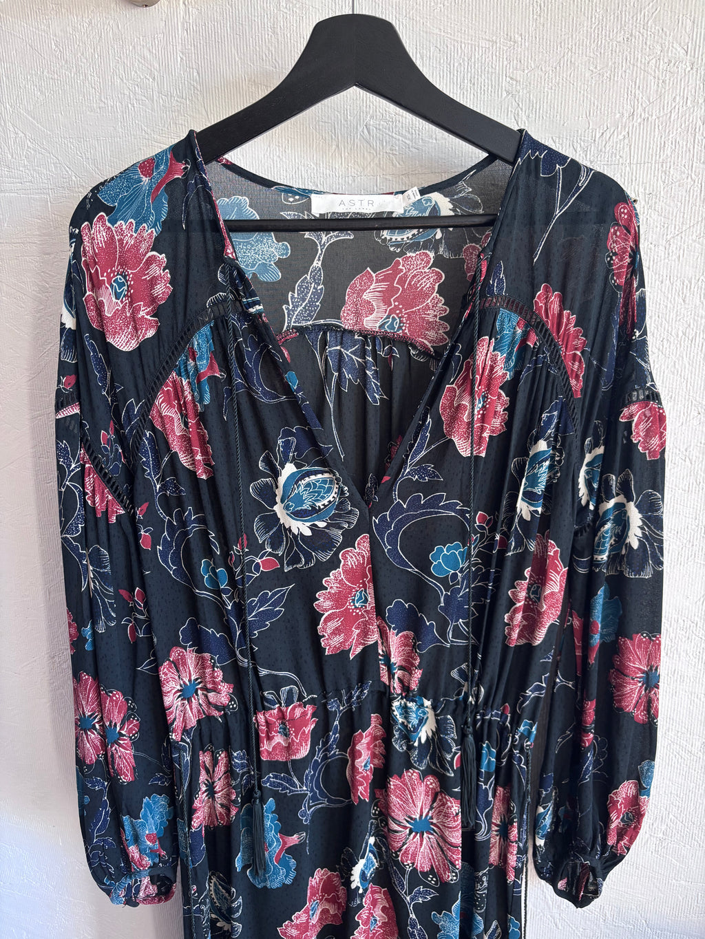 Revolve’s ASTR The Label Oversized Floral Boho Long Sleeve Hi Lo Tassel Drawstring Low Cut Maxi Dress