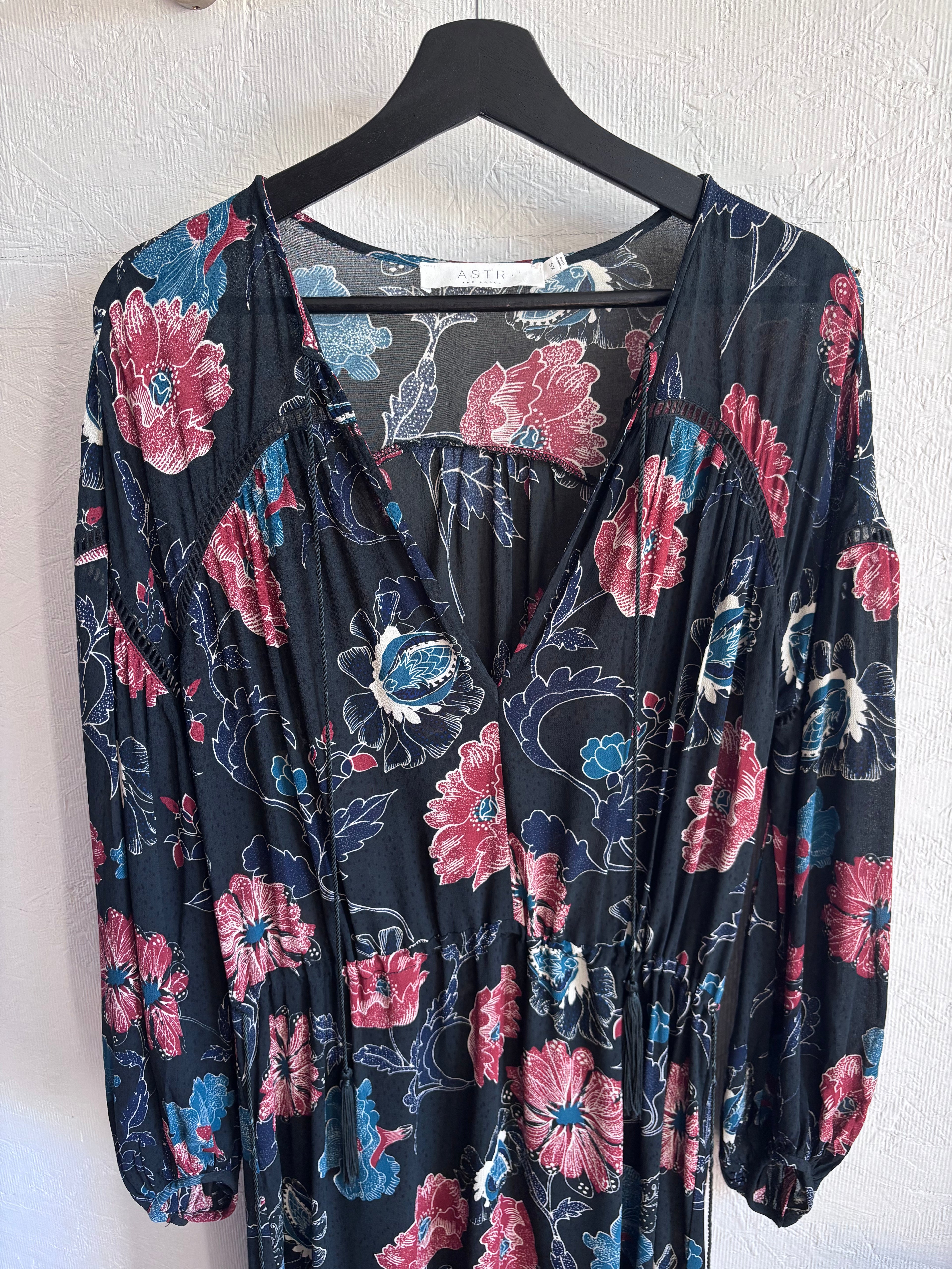 Revolve’s ASTR The Label Oversized Floral Boho Long Sleeve Hi Lo Tassel Drawstring Low Cut Maxi Dress