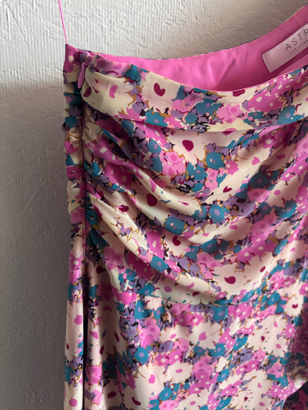 Revolve’s ASTR The Label Pink Floral One Puff Sleeve Asymmetrical Midi Dress