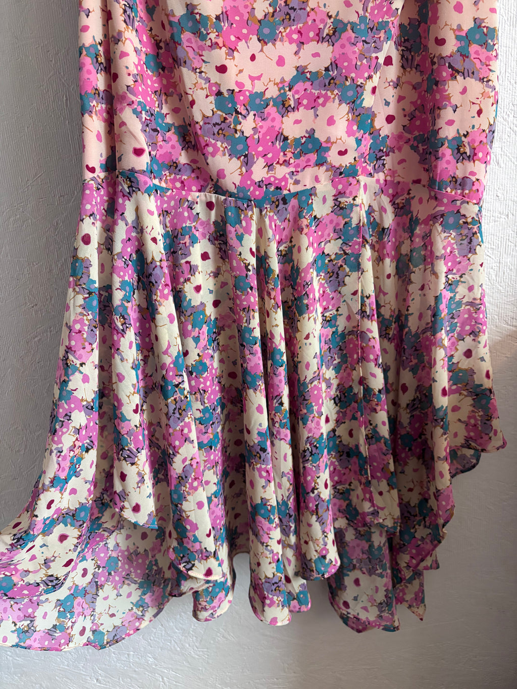 Revolve’s ASTR The Label Pink Floral One Puff Sleeve Asymmetrical Midi Dress